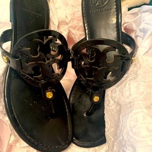 Tory Burch Miller Sandal in black patent leather.